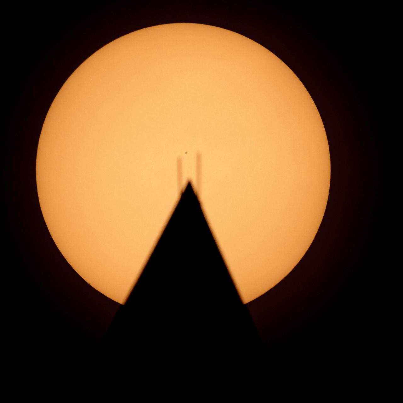 The planet Mercury is seen in silhouette, center, as it transits across the face of the Sun, behind the Washington Monument, Monday, Nov. 11, 2019, in Washington. Mercury’s last transit was in 2016. The next won’t happen again until 2032. Photo Credit: (NASA/Bill Ingalls)