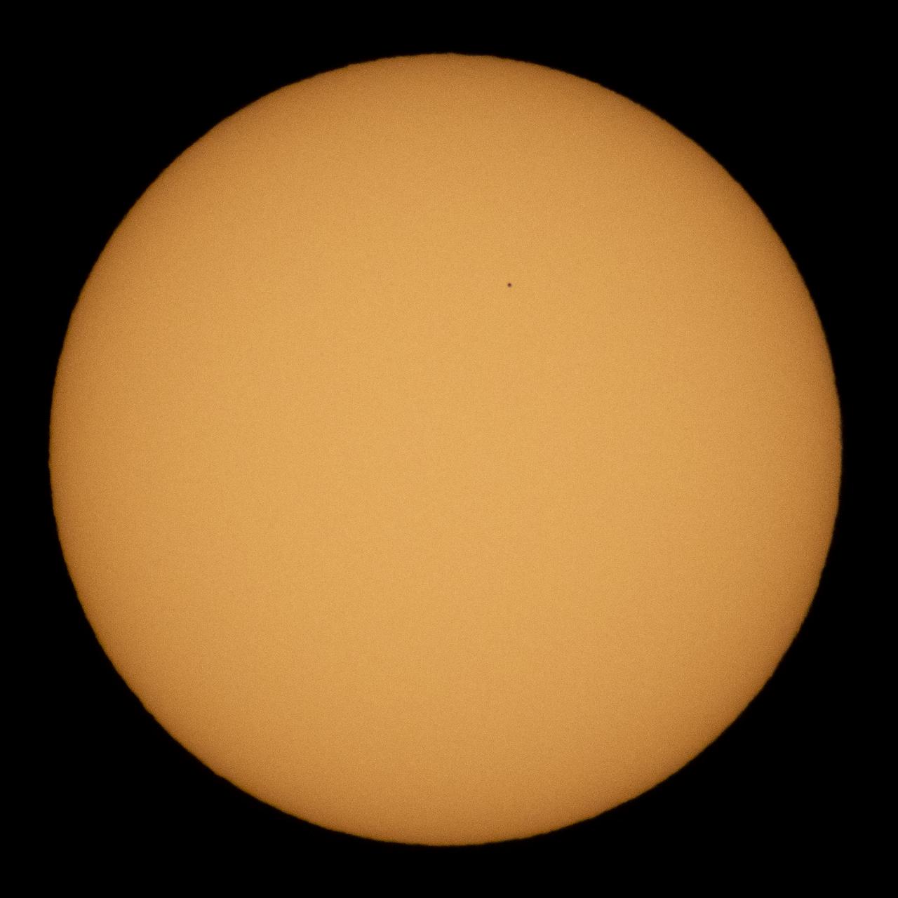 The planet Mercury is seen in silhouette as it transits across the face of the sun, Monday, Nov. 11, 2019 in Salt Lake City, Utah. Mercury’s last transit was in 2016.  the next won't happen again until 2032. Photo Credit: (NASA/Joel Kowsky)