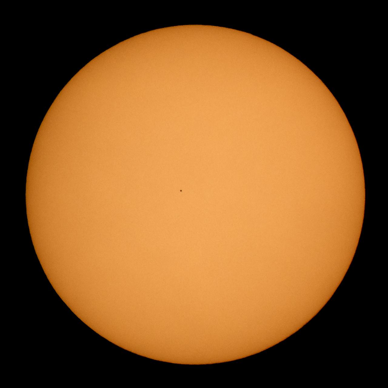 The planet Mercury is seen in silhouette, center, as it transits across the face of the Sun Monday, Nov. 11, 2019, from Washington. Mercury’s last transit was in 2016. The next won’t happen again until 2032. Photo Credit: (NASA/Bill Ingalls)