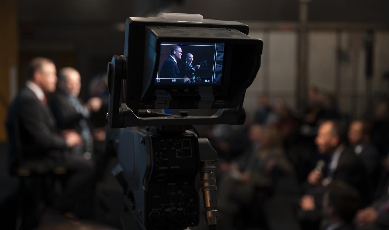 NASA Administrator Jim Bridenstine and NASA Associate Administrator for the Human Exploration and Operations Mission Directorate Douglas Loverro are seen on a monitor as they answer a question during a NASA town hall event, Tuesday, Dec. 3, 2019, at NASA Headquarters in Washington. Photo Credit: (NASA/Joel Kowsky)