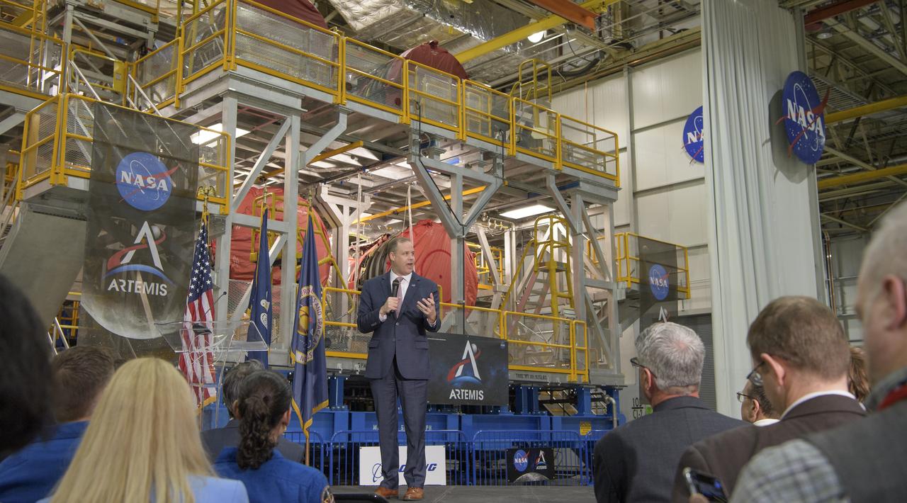 NASA Administrator Jim Bridenstine gives remarks on the agency’s Artemis program, Monday, Dec. 9, 2019, in front of the core stage for NASA’s Space Launch System (SLS) rocket at NASA’s Michoud Assembly Facility in New Orleans. Through Artemis NASA will land the first woman and next man on the Moon by 2024. Photo Credit: (NASA/Bill Ingalls)