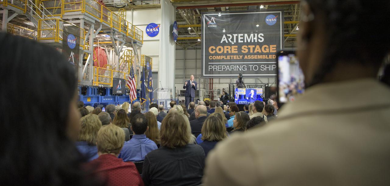 NASA Administrator Jim Bridenstine gives remarks on the agency’s Artemis program, Monday, Dec. 9, 2019, in front of the core stage for NASA’s Space Launch System (SLS) rocket at NASA’s Michoud Assembly Facility in New Orleans. Through Artemis NASA will land the first woman and next man on the Moon by 2024. Photo Credit: (NASA/Bill Ingalls)