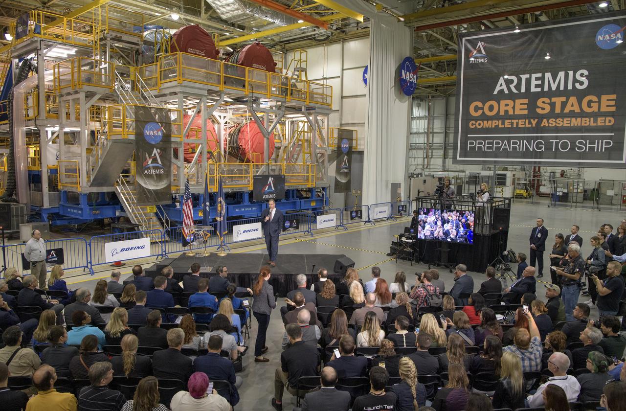 NASA Administrator Jim Bridenstine gives remarks on the agency’s Artemis program, Monday, Dec. 9, 2019, in front of the core stage for NASA’s Space Launch System (SLS) rocket at NASA’s Michoud Assembly Facility in New Orleans. Through Artemis NASA will land the first woman and next man on the Moon by 2024. Photo Credit: (NASA/Bill Ingalls)