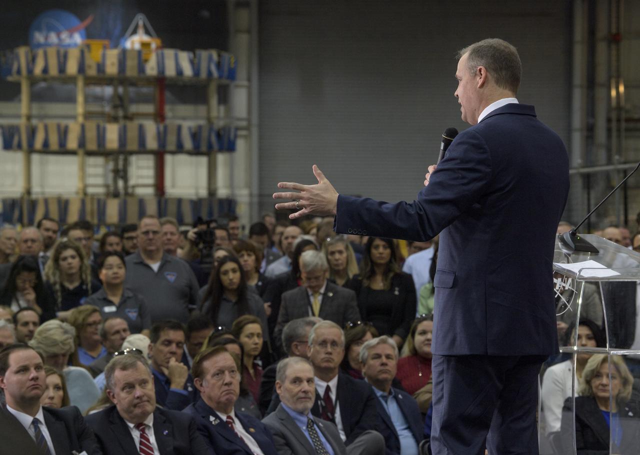 NASA Administrator Jim Bridenstine gives remarks on the agency’s Artemis program, Monday, Dec. 9, 2019, in front of the core stage for NASA’s Space Launch System (SLS) rocket at NASA’s Michoud Assembly Facility in New Orleans. Through Artemis NASA will land the first woman and next man on the Moon by 2024. Photo Credit: (NASA/Bill Ingalls)