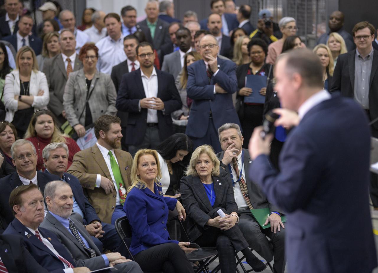 NASA Administrator Jim Bridenstine gives remarks on the agency’s Artemis program, Monday, Dec. 9, 2019, in front of the core stage for NASA’s Space Launch System (SLS) rocket at NASA’s Michoud Assembly Facility in New Orleans. Through Artemis NASA will land the first woman and next man on the Moon by 2024. Photo Credit: (NASA/Bill Ingalls)