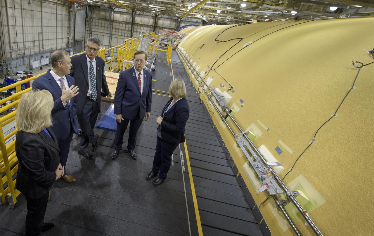 NASA Marshall Space Flight Center Director Jody Singer, left, NASA Administrator Jim Bridenstine, NASA Marshall Space Flight Center Deputy Program manager, Space Launch System Program, Chris Cianciola, U.S. Representative Randy Weber (R-TX), and Boeing Director of operations at Michoud Assembly Facility Jennifer Boland-Masterson, right, view the core stage for NASA’s Space Launch System (SLS) rocket that will help power the first Artemis mission to the Moon, Monday, Dec. 9, 2019, at NASA’s Michoud Assembly Facility in New Orleans. Through Artemis NASA will land the first woman and next man on the Moon by 2024. Photo Credit: (NASA/Bill Ingalls)