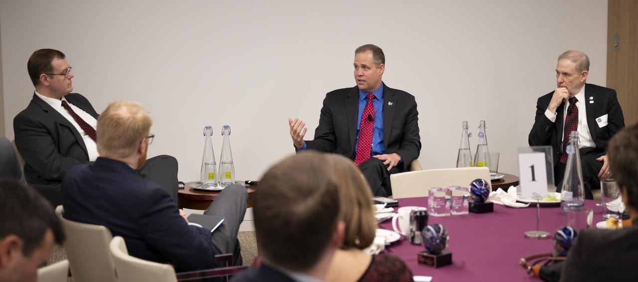 Jeff Foust, senior staff writer at SpaceNews, left, moderates a discussion with NASA Administrator Jim Bridenstine and NASA Associate Administrator for the Human Exploration and Operations Mission Directorate Douglas Loverro at the 3rd Annual SpaceNews Awards, Tuesday, Dec. 10, 2019, at Hogan Lovells in Washington. Photo Credit: (NASA/Joel Kowsky)