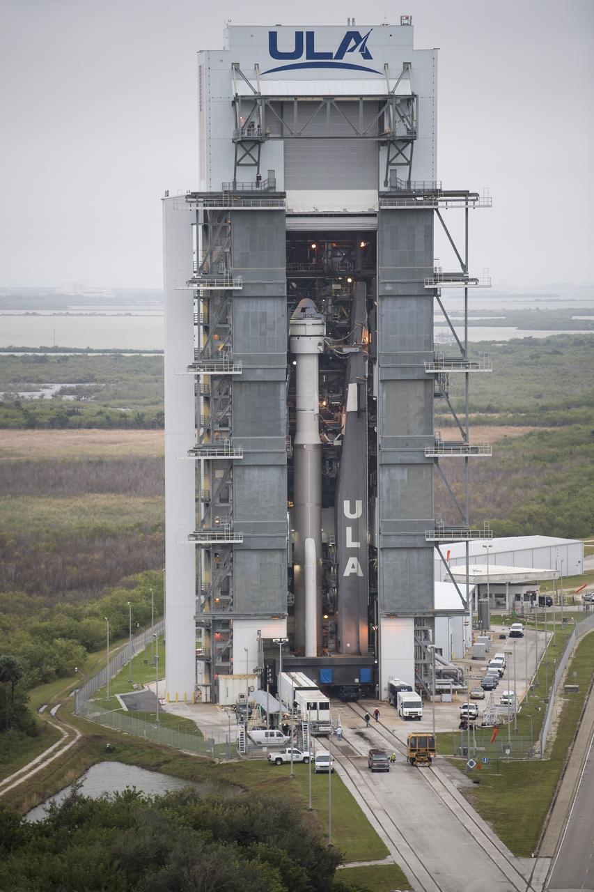 A United Launch Alliance Atlas V rocket with Boeing’s CST-100 Starliner spacecraft onboard is seen before being rollout out of the Vertical Integration Facility to the launch pad at Space Launch Complex 41 ahead of the Orbital Flight Test mission, Wednesday, Dec. 18, 2019 at Cape Canaveral Air Force Station in Florida. The uncrewed Orbital Flight Test will be Starliner’s maiden mission to the International Space Station for NASA's Commercial Crew Program. The mission, currently targeted for a 6:26 a.m. EST launch on Dec. 20, will serve as an end-to-end test of the system's capabilities. Photo Credit: (NASA/Joel Kowsky)
