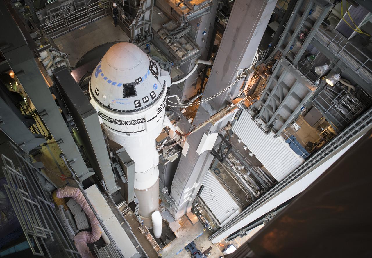A United Launch Alliance Atlas V rocket with Boeing’s CST-100 Starliner spacecraft onboard is seen inside the Vertical Integration Facility before being rolled out to the launch pad at Space Launch Complex 41 ahead of the Orbital Flight Test mission, Wednesday, Dec. 18, 2019 at Cape Canaveral Air Force Station in Florida. The uncrewed Orbital Flight Test will be Starliner’s maiden mission to the International Space Station for NASA's Commercial Crew Program. The mission, currently targeted for a 6:26 a.m. EST launch on Dec. 20, will serve as an end-to-end test of the system's capabilities. Photo Credit: (NASA/Joel Kowsky)