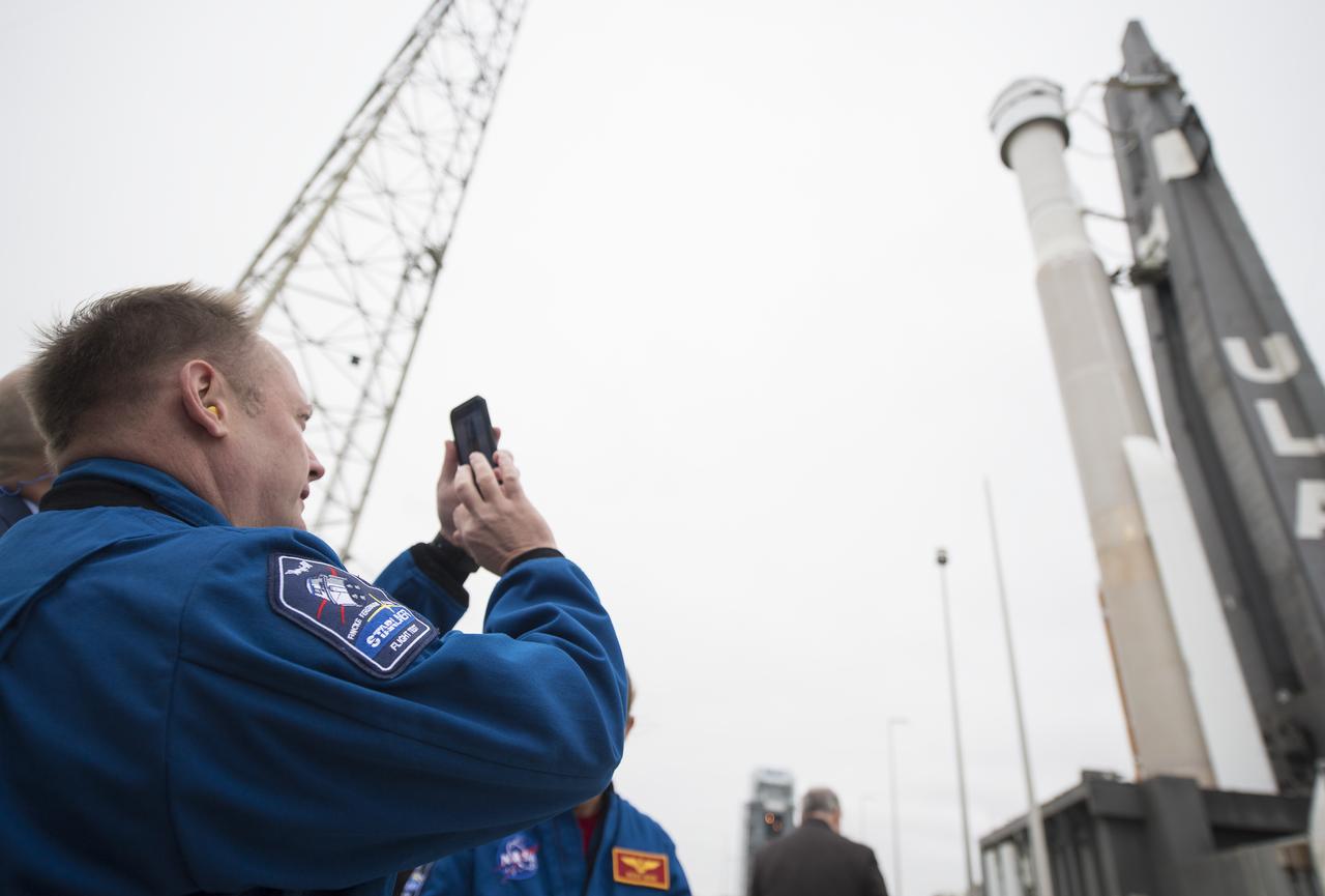 NASA astronaut Michael Fincke takes a pictures of a United Launch Alliance Atlas V rocket with Boeing’s CST-100 Starliner spacecraft onboard is seen as it is rollout out of the Vertical Integration Facility to the launch pad at Space Launch Complex 41 ahead of the Orbital Flight Test mission, Wednesday, Dec. 18, 2019 at Cape Canaveral Air Force Station in Florida. The uncrewed Orbital Flight Test with be Starliner’s maiden mission to the International Space Station for NASA's Commercial Crew Program. The mission, currently targeted for a 6:26 a.m. EST launch on Dec. 20, will serve as an end-to-end test of the system's capabilities. Photo Credit: (NASA/Joel Kowsky)