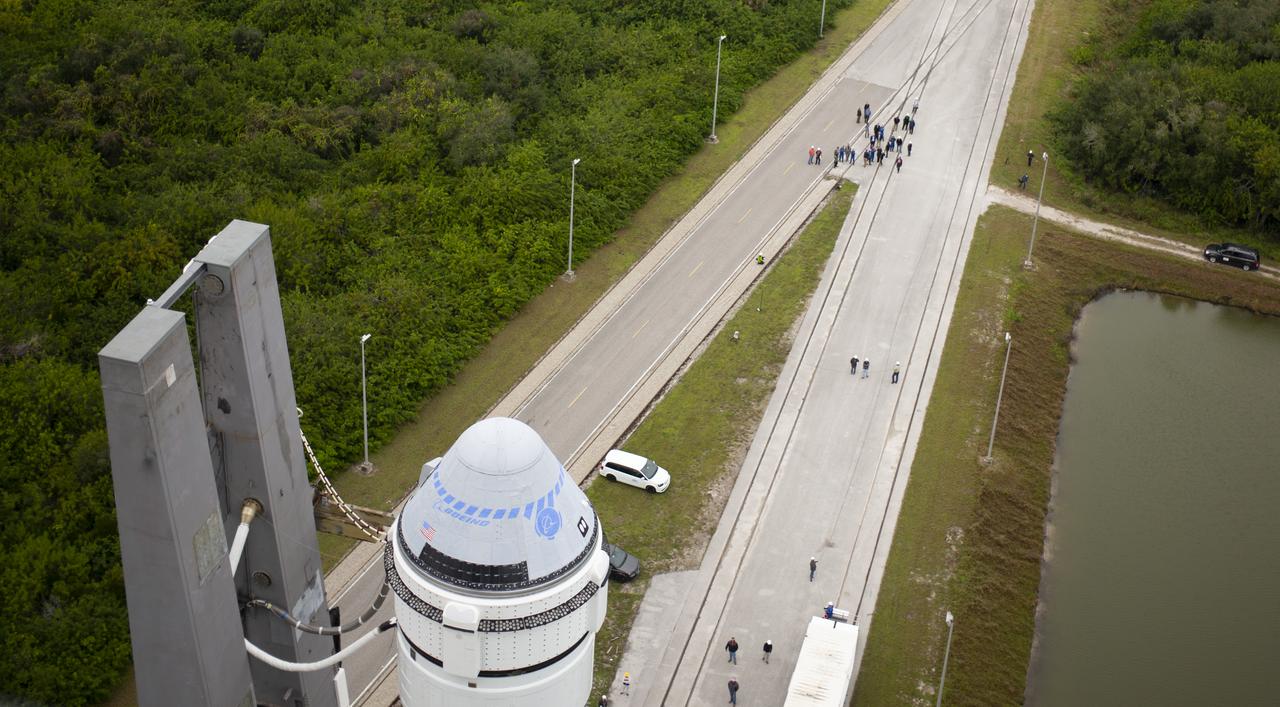 A United Launch Alliance Atlas V rocket with Boeing’s CST-100 Starliner spacecraft onboard is seen as it is rollout out of the Vertical Integration Facility to the launch pad at Space Launch Complex 41 ahead of the Orbital Flight Test mission, Wednesday, Dec. 18, 2019 at Cape Canaveral Air Force Station in Florida. The uncrewed Orbital Flight Test will be Starliner’s maiden mission to the International Space Station for NASA's Commercial Crew Program. The mission, currently targeted for a 6:26 a.m. EST launch on Dec. 20, will serve as an end-to-end test of the system's capabilities. Photo Credit: (NASA/Joel Kowsky)