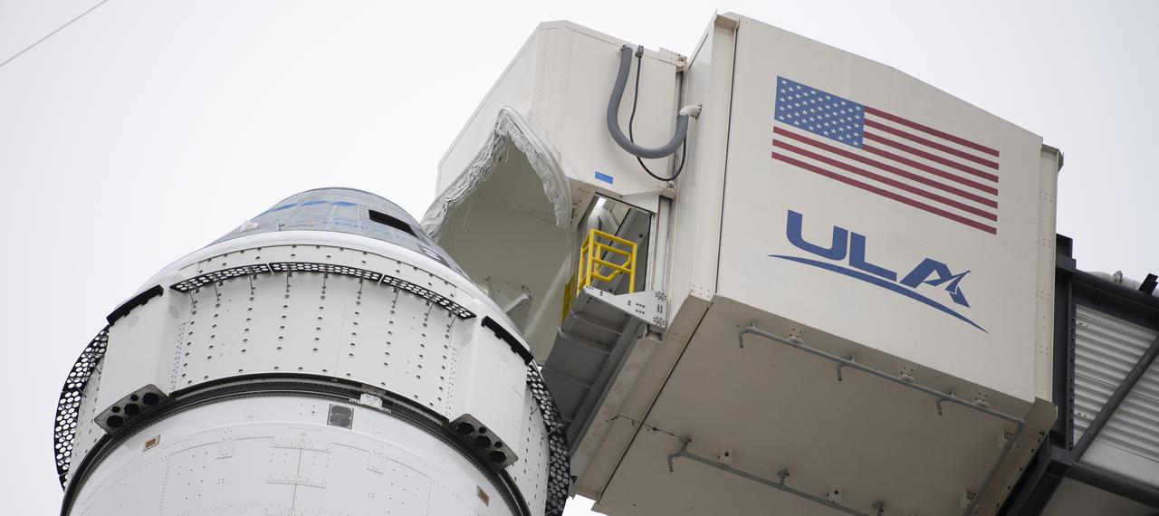 The crew access arm is seen after being moved into position for Boeing’s CST-100 Starliner spacecraft atop a United Launch Alliance Atlas V rocket on the launch pad at Space Launch Complex 41 ahead of the Orbital Flight Test mission, Wednesday, Dec. 18, 2019 at Cape Canaveral Air Force Station in Florida. The uncrewed Orbital Flight Test with be Starliner’s maiden mission to the International Space Station for NASA's Commercial Crew Program. The mission, currently targeted for a 6:26 a.m. EST launch on Dec. 20, will serve as an end-to-end test of the system's capabilities. Photo Credit: (NASA/Joel Kowsky)
