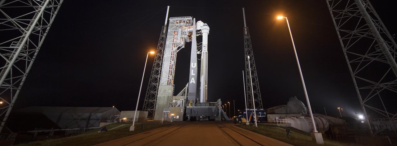 A United Launch Alliance Atlas V rocket with Boeing’s CST-100 Starliner spacecraft onboard is seen illuminated by spotlights on the launch pad at Space Launch Complex 41 ahead of the Orbital Flight Test mission, Wednesday, Dec. 18, 2019 at Cape Canaveral Air Force Station in Florida. The uncrewed Orbital Flight Test will be Starliner’s maiden mission to the International Space Station for NASA's Commercial Crew Program. The mission, currently targeted for a 6:26 a.m. EST launch on Dec. 20, will serve as an end-to-end test of the system's capabilities. Photo Credit: (NASA/Joel Kowsky)