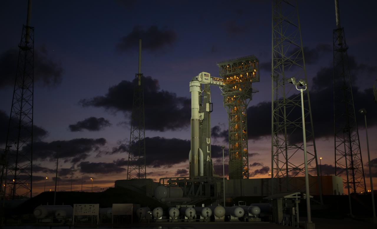 A United Launch Alliance Atlas V rocket with Boeing’s CST-100 Starliner spacecraft onboard is seen illuminated by spotlights on the launch pad at Space Launch Complex 41 ahead of the Orbital Flight Test mission, Wednesday, Dec. 18, 2019 at Cape Canaveral Air Force Station in Florida. The uncrewed Orbital Flight Test will be Starliner’s maiden mission to the International Space Station for NASA's Commercial Crew Program. The mission, currently targeted for a 6:26 a.m. EST launch on Dec. 20, will serve as an end-to-end test of the system's capabilities. Photo Credit: (NASA/Joel Kowsky)