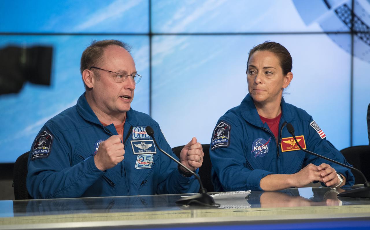 NASA astronauts Michael Fincke, left, and Nicole Mann, right, are seen during a press conference at NASA's Kennedy Space Center following the launch of Boeing’s Starliner spacecraft onboard a United Launch Alliance Atlas V rocket, Friday, Dec. 20, 2019, at Cape Canaveral Air Force Station in Florida. After a successful launch at 6:36 a.m. EST, Boeing’s CST-100 Starliner is in an unplanned, but stable orbit. The team is assessing what test objectives can be achieved before the spacecraft’s return to land in White Sands, New Mexico. Fincke and Mann are assigned to fly on Starliner’s Crew Flight Test along with Boeing astronaut Chris Ferguson. Photo Credit: (NASA/Joel Kowsky)