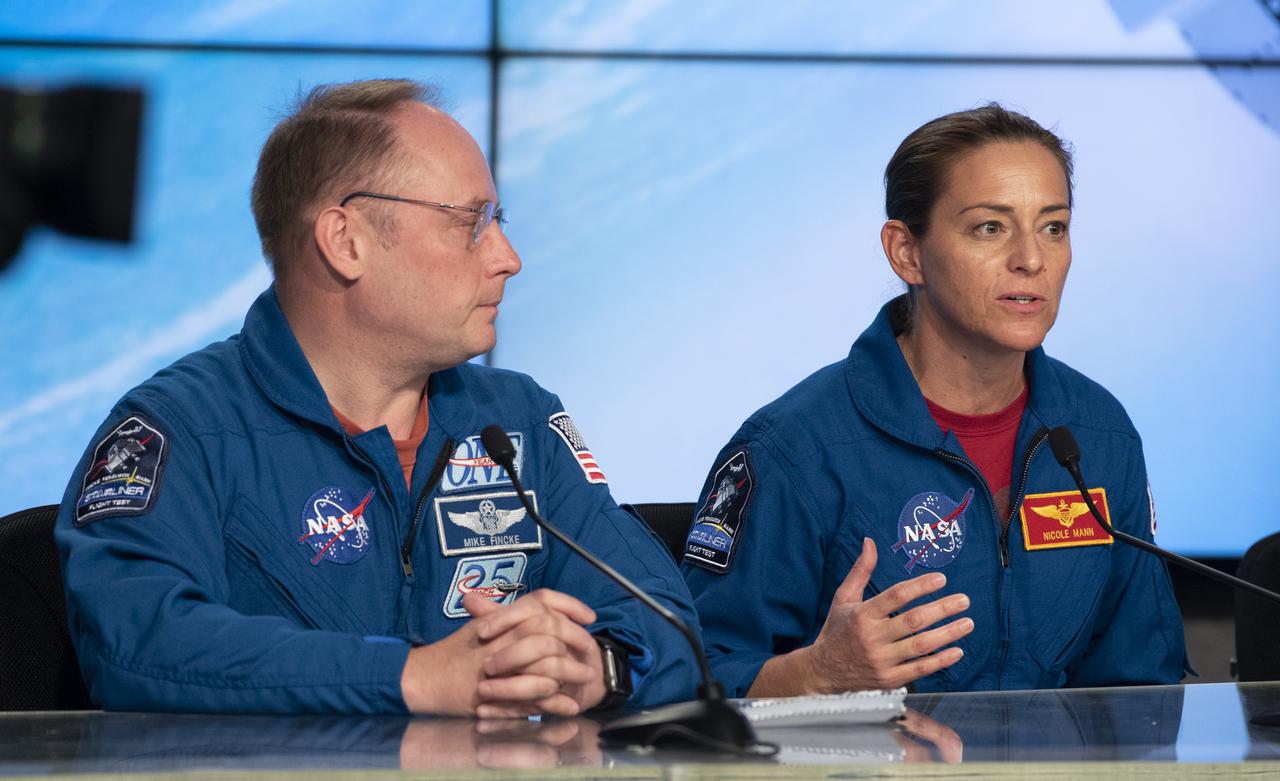 NASA astronauts Michael Fincke, left, and Nicole Mann, right, are seen during a press conference at NASA's Kennedy Space Center following the launch of Boeing’s Starliner spacecraft onboard a United Launch Alliance Atlas V rocket, Friday, Dec. 20, 2019, at Cape Canaveral Air Force Station in Florida. After a successful launch at 6:36 a.m. EST, Boeing’s CST-100 Starliner is in an unplanned, but stable orbit. The team is assessing what test objectives can be achieved before the spacecraft’s return to land in White Sands, New Mexico. Fincke and Mann are assigned to fly on Starliner’s Crew Flight Test along with Boeing astronaut Chris Ferguson. Photo Credit: (NASA/Joel Kowsky)