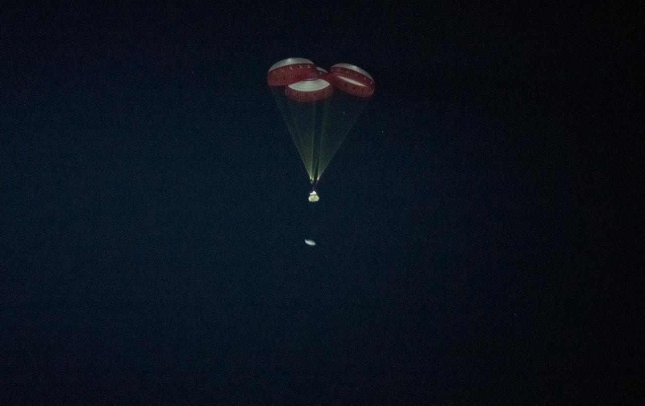 The Boeing CST-100 Starliner spacecraft jettisons the heat shield before it lands in White Sands, New Mexico, Sunday, Dec. 22, 2019. The landing completes an abbreviated Orbital Flight Test for the company that still meets several mission objectives for NASA’s Commercial Crew program. The Starliner spacecraft launched on a United Launch Alliance Atlas V rocket at 6:36 a.m. Friday, Dec. 20 from Space Launch Complex 41 at Cape Canaveral Air Force Station in Florida. Photo Credit: (NASA/Aubrey Gemignani)