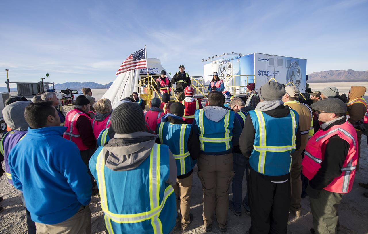 Louis Atchison, chief of launch and recovery operations, Boeing Commercial Crew Program, speaks to the teams from NASA, Boeing, and the White Sands Missile Range, after the Boeing CST-100 Starliner spacecraft landed in White Sands, New Mexico, Sunday, Dec. 22, 2019. The landing completes an abbreviated Orbital Flight Test for the company that still meets several mission objectives for NASA’s Commercial Crew program. The Starliner spacecraft launched on a United Launch Alliance Atlas V rocket at 6:36 a.m. Friday, Dec. 20 from Space Launch Complex 41 at Cape Canaveral Air Force Station in Florida. Photo Credit: (NASA/Aubrey Gemignani)