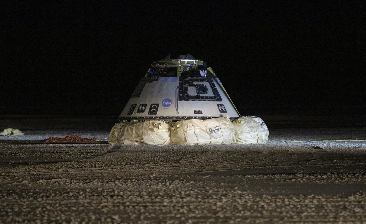 The Boeing CST-100 Starliner spacecraft is seen after it landed in White Sands, New Mexico, Sunday, Dec. 22, 2019. The landing completes an abbreviated Orbital Flight Test for the company that still meets several mission objectives for NASA’s Commercial Crew program. The Starliner spacecraft launched on a United Launch Alliance Atlas V rocket at 6:36 a.m. Friday, Dec. 20 from Space Launch Complex 41 at Cape Canaveral Air Force Station in Florida. Photo Credit: (NASA/Bill Ingalls)