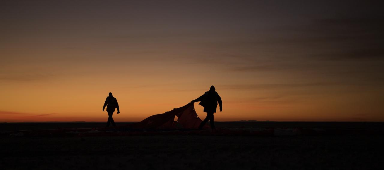 Boeing, NASA, and U.S. Army personnel collect parachutes around the Boeing CST-100 Starliner spacecraft shortly after it landed in White Sands, New Mexico, Sunday, Dec. 22, 2019. The landing completes an abbreviated Orbital Flight Test for the company that still meets several mission objectives for NASA’s Commercial Crew program. The Starliner spacecraft launched on a United Launch Alliance Atlas V rocket at 6:36 a.m. Friday, Dec. 20 from Space Launch Complex 41 at Cape Canaveral Air Force Station in Florida. Photo Credit: (NASA/Bill Ingalls)