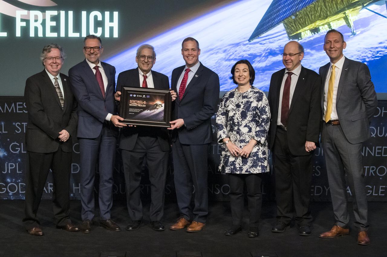 From left to right, National Oceanic and Atmospheric Administration (NOAA) assistant administrator for Satellite and Information Services, Stephen Volz; ESA (European Space Agency) director of Earth Observation Programmes, Josef Aschbacher; Former director of NASA’s Earth Science Division, Mike Freilich; NASA Administrator Jim Bridenstine; Head of Global Issues and Innovation of the European Union delegation to the United States, Mercedes Garcia Pérez; EUMETSAT director-general, Alain Ratier; and NASA associate administrator for Science, Thomas Zurbuchen pose for a group photo at the conclusion of a renaming ceremony for the international ocean science satellite previously known as Sentinel-6A/Jason-CS, Tuesday, January 28, 2020, at NASA Headquarters in Washington. NASA and its European partners renamed the satellite Sentinel-6 Michael Freilich after Dr. Freilich. Sentinel-6A Michael Freilich will observe and record global sea level changes and will be joined by an identical satellite slated to launch in 2025 for a total of ten years of targeted observations.  Photo Credit: (NASA/Aubrey Gemignani)