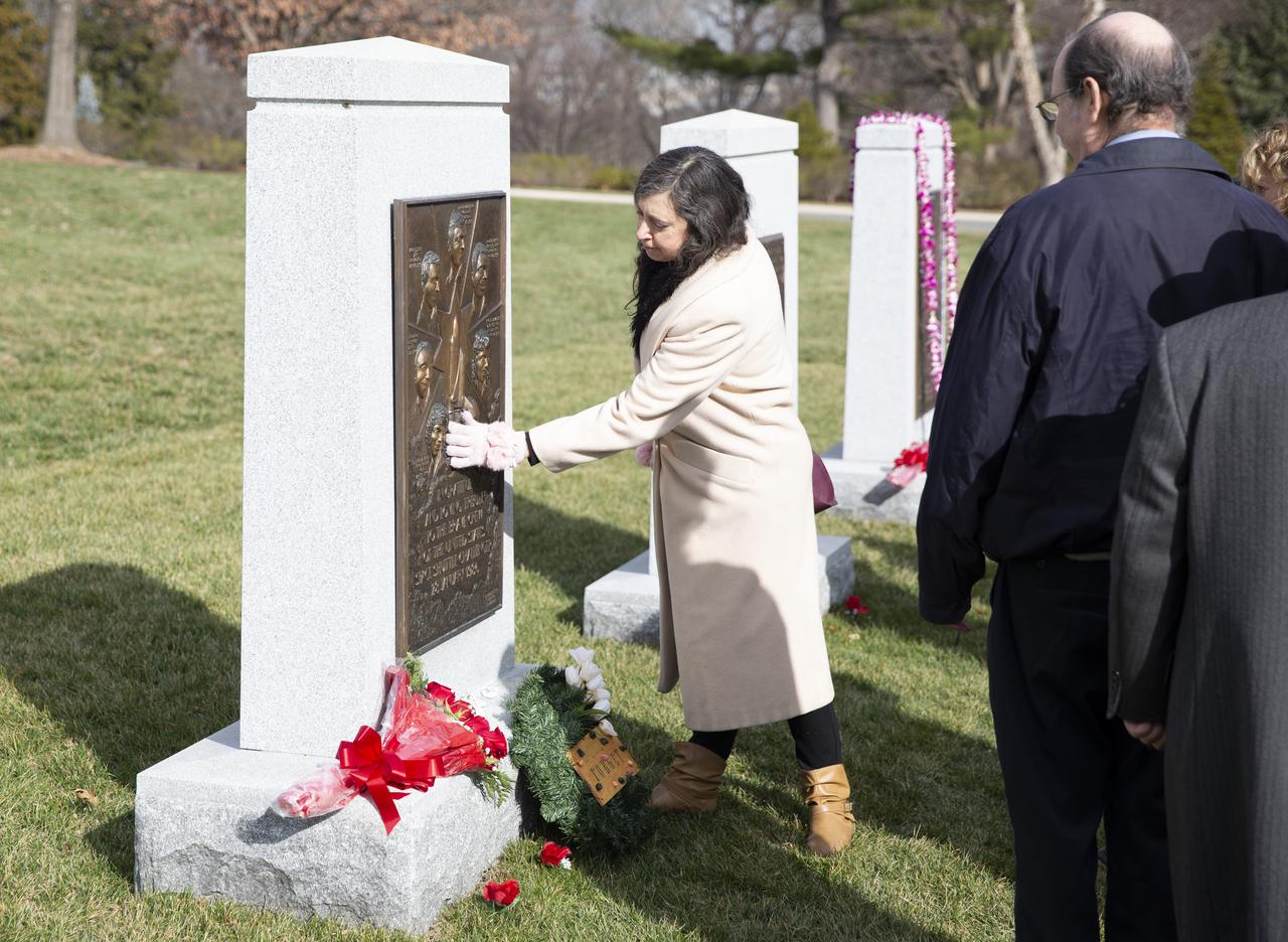 Amy Resnik, wife of Chuck Resnik, touches the Space Shuttle Challenger Memorial after a wreath laying ceremony as part of NASA’s Day of Remembrance, Thursday, Jan. 30, 2020, at Arlington National Cemetery in Arlington, Va. Chuck Resnik is the brother of late space shuttle Challenger astronaut Judy Resnik. The wreaths were laid in memory of those men and women who lost their lives in the quest for space exploration. Photo Credit: (NASA/Joel Kowsky)
