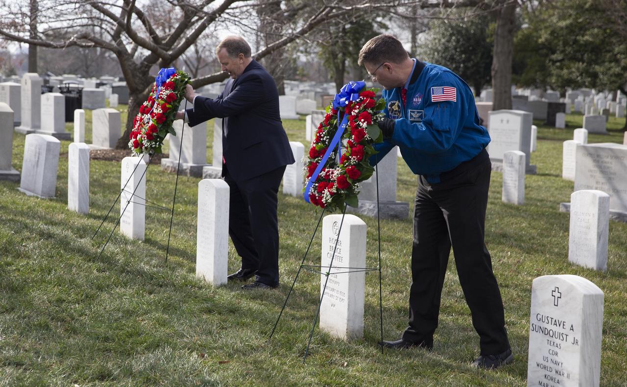 NASA Deputy Administrator Jim Morhard, left, and NASA astronaut Doug Wheelock, right, place wreaths at the graves of Apollo 1 astronauts Virgil “Gus” Grissom, and Roger Chaffee as part of NASA’s Day of Remembrance, Thursday, Jan. 30, 2020, at Arlington National Cemetery in Arlington, Va. The wreaths were laid in memory of those men and women who lost their lives in the quest for space exploration. Photo Credit: (NASA/Joel Kowsky)