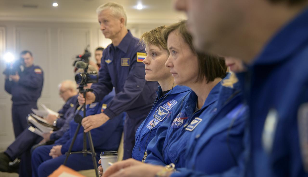 NASA astronauts Anne McClain, left, and Megan McArthur listen as NASA, ESA, Roscosmos, and Russian Search and Recovery Forces meet at the Cosmonaut Hotel in Karaganda, Kazakhstan to discuss the readiness for the landing of Expedition 61 crew members Christina Koch of NASA, Alexander Skvortsov of the Russian space agency Roscosmos, and Luca Parmitano of ESA (European Space Agency) Tuesday, Feb. 4, 2020, at the Cosmonaut Hotel in Karaganda, Kazakhstan. Koch will be returning to Earth after logging 328 days in space --- the longest spaceflight in history by a woman --- as a member of Expeditions 59-60-61 on the International Space Station. Skvortsov and Parmitano will be returning after 201 days in space where they served as Expedition 60-61 crew members onboard the station. Photo Credit: (NASA/Bill Ingalls)