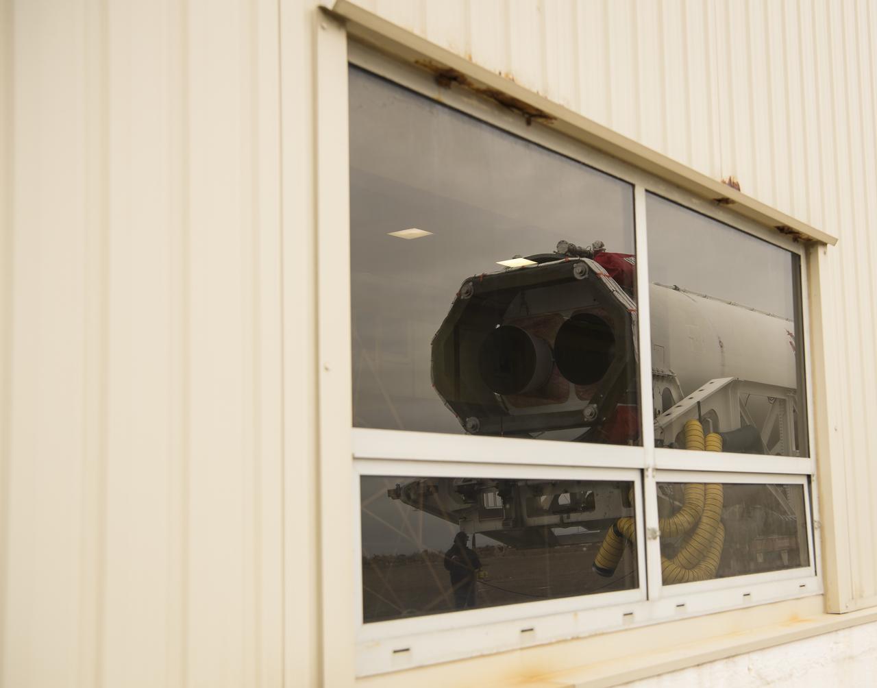 A reflection of the Northrop Grumman Antares rocket is seen as it is rolled out to Pad-0A, Wednesday, Feb. 5, 2020, at NASA's Wallops Flight Facility in Virginia. Northrop Grumman’s 13th contracted cargo resupply mission with NASA to the International Space Station will deliver more than 7,500 pounds of science and research, crew supplies and vehicle hardware to the orbital laboratory and its crew. The CRS-13 Cygnus spacecraft is named after the first African American astronaut, Major Robert Henry Lawrence Jr. and is scheduled to launch at 5:39pm EST Sunday, Feb. 9. Photo Credit: (NASA/Aubrey Gemignani)