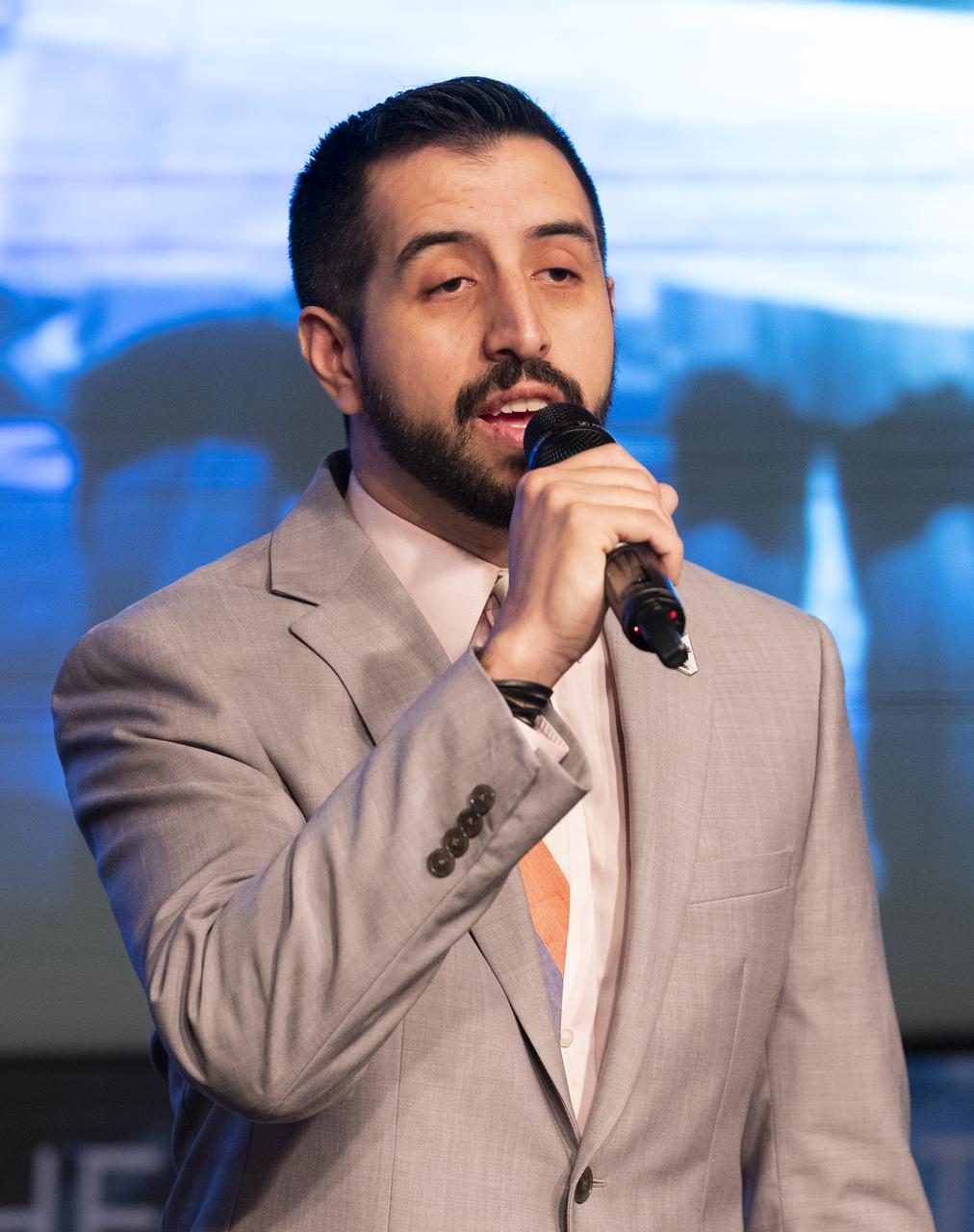 NASA digital content strategist Andres Almeida sings the National Anthem before a discussion between Retired U.S. Air Force Honorary Brigadier General Charles McGee and NASA astronaut Alvin Drew during a Black History Month program titled “Trailblazers, The Story of a Tuskegee Airman,” Wednesday, Feb. 5, 2020, at NASA Headquarters in Washington, DC. McGee, a pilot with the Tuskegee Airmen during World War II, was a career officer in the Air Force also serving during the Korean and Vietnam Wars. Over his 30 years of service he flew 409 combat missions. Of the 355 Tuskegee pilots who flew in combat, McGee is one of only nine surviving. Photo Credit: (NASA/Joel Kowsky)