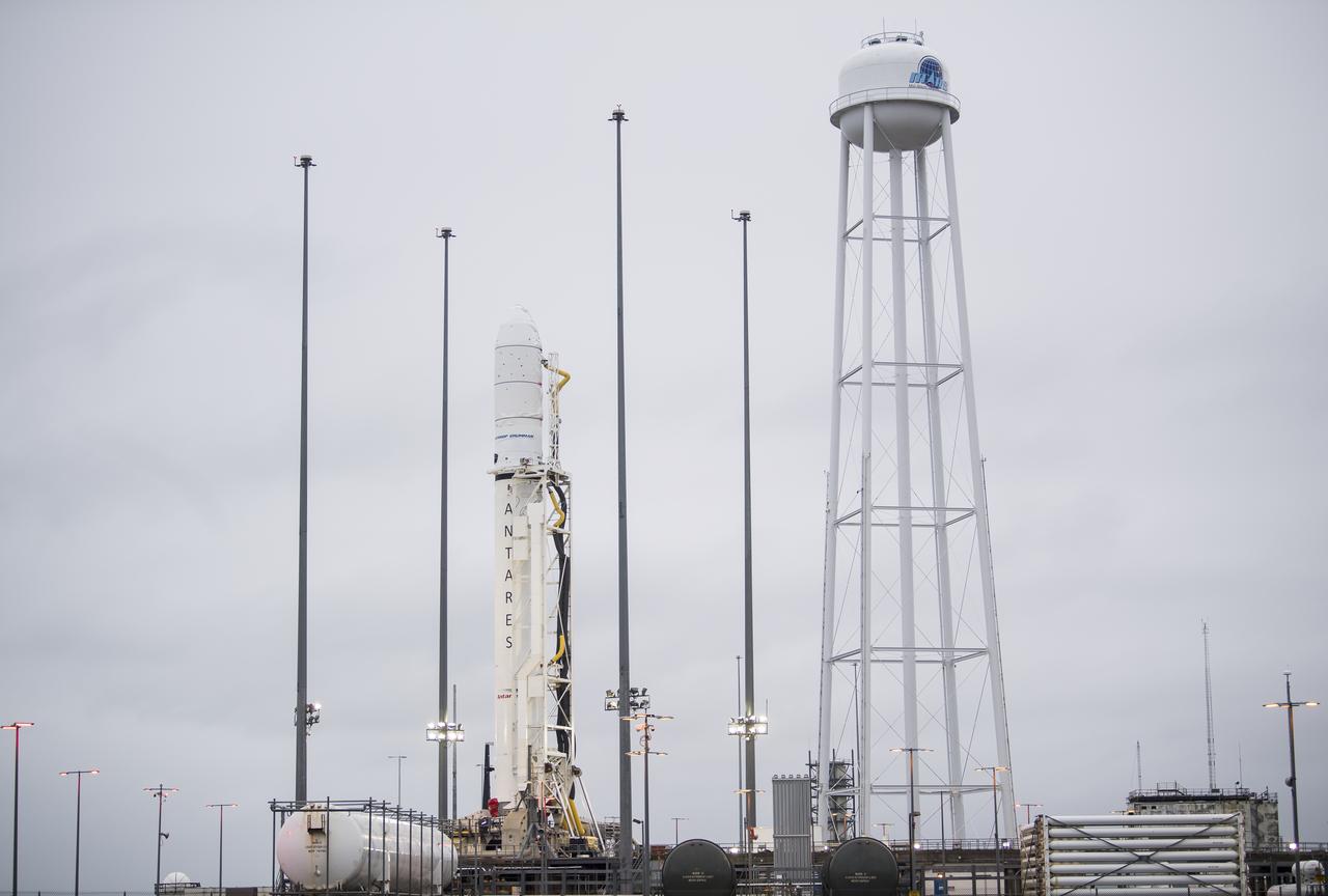 A Northrop Grumman Antares rocket carrying a Cygnus resupply spacecraft is seen just after being raised into a vertical position on Pad-0A, Wednesday, Feb. 5, 2020, at NASA's Wallops Flight Facility in Virginia. Northrop Grumman’s 13th contracted cargo resupply mission with NASA to the International Space Station will deliver about 8,000 pounds of science and research, crew supplies and vehicle hardware to the orbital laboratory and its crew. The CRS-13 Cygnus spacecraft is named after the first African American astronaut, Major Robert Henry Lawrence Jr., and is scheduled to launch at 5:39pm EST Sunday, Feb. 9. Photo Credit: (NASA/Aubrey Gemignani)