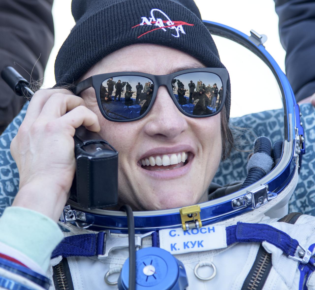 NASA astronaut Christina Koch is seen outside the Soyuz MS-13 spacecraft after she, Roscosmos cosmonaut Alexander Skvortsov, and ESA astronaut Luca Parmitano landed in a remote area near the town of Zhezkazgan, Kazakhstan on Thursday, Feb. 6, 2020. Koch returned to Earth after logging 328 days in space --- the longest spaceflight in history by a woman --- as a member of Expeditions 59-60-61 on the International Space Station. Skvortsov and Parmitano returned after 201 days in space where they served as Expedition 60-61 crew members onboard the station. Photo Credit: (NASA/Bill Ingalls)