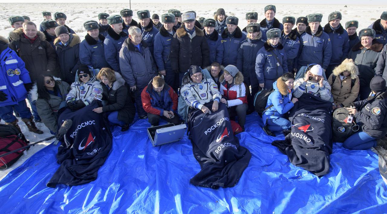 NASA astronaut Christina Koch, left, Roscosmos cosmonaut Alexander Skvortsov, center, and ESA astronaut Luca Parmitano sit in chairs outside the Soyuz MS-13 spacecraft after they landed in a remote area near the town of Zhezkazgan, Kazakhstan on Thursday, Feb. 6, 2020. Koch returned to Earth after logging 328 days in space --- the longest spaceflight in history by a woman --- as a member of Expeditions 59-60-61 on the International Space Station. Skvortsov and Parmitano returned after 201 days in space where they served as Expedition 60-61 crew members onboard the station. Photo Credit: (NASA/Bill Ingalls)