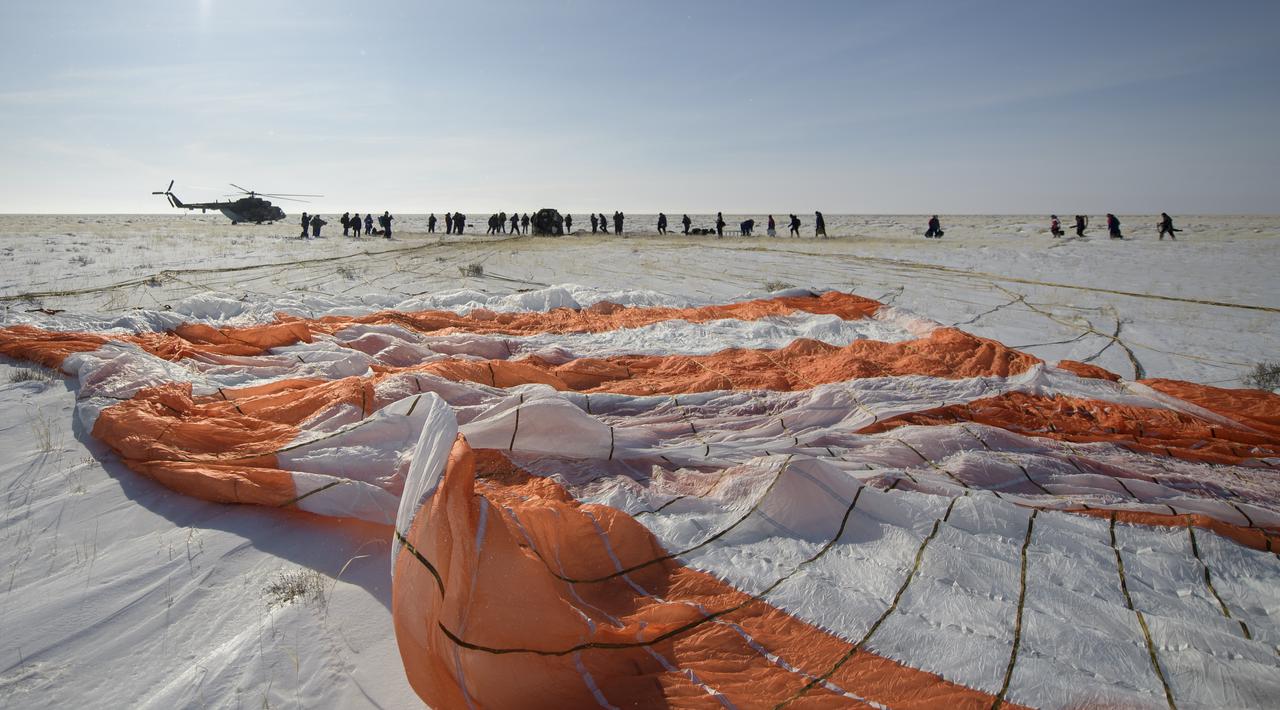 Russian support personnel work around the Soyuz MS-13 spacecraft shortly after it landed n a remote area near the town of Zhezkazgan, Kazakhstan with Expedition 61 crew members Christina Koch of NASA, Alexander Skvortsov of the Russian space agency Roscosmos, and Luca Parmitano of ESA (European Space Agency) Thursday, Feb. 6, 2020. Koch returned to Earth after logging 328 days in space --- the longest spaceflight in history by a woman --- as a member of Expeditions 59-60-61 on the International Space Station. Skvortsov and Parmitano returned after 201 days in space where they served as Expedition 60-61 crew members onboard the station. Photo Credit: (NASA/Bill Ingalls)