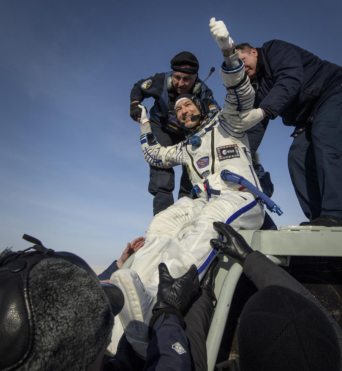ESA astronaut Luca Parmitano is helped out of the Soyuz MS-13 spacecraft just minutes after he, NASA astronaut Christina Koch, and Roscosmos cosmonaut Alexander Skvortsov, landed their Soyuz MS-13 capsule in a remote area near the town of Zhezkazgan, Kazakhstan on Thursday, Feb. 6, 2020. Koch returned to Earth after logging 328 days in space --- the longest spaceflight in history by a woman --- as a member of Expeditions 59-60-61 on the International Space Station. Skvortsov and Parmitano returned after 201 days in space where they served as Expedition 60-61 crew members onboard the station. Photo Credit: (NASA/Bill Ingalls)