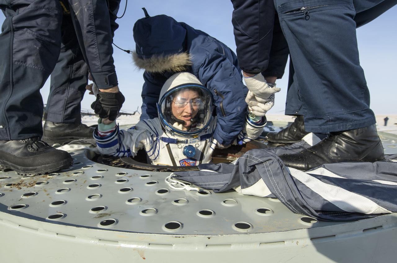 NASA astronaut Christina Koch is helped out of the Soyuz MS-13 spacecraft just minutes after she, Roscosmos cosmonaut Alexander Skvortsov, and ESA astronaut Luca Parmitano, landed in a remote area near the town of Zhezkazgan, Kazakhstan on Thursday, Feb. 6, 2020. Koch returned to Earth after logging 328 days in space --- the longest spaceflight in history by a woman --- as a member of Expeditions 59-60-61 on the International Space Station. Skvortsov and Parmitano returned after 201 days in space where they served as Expedition 60-61 crew members onboard the station. Photo Credit: (NASA/Bill Ingalls)