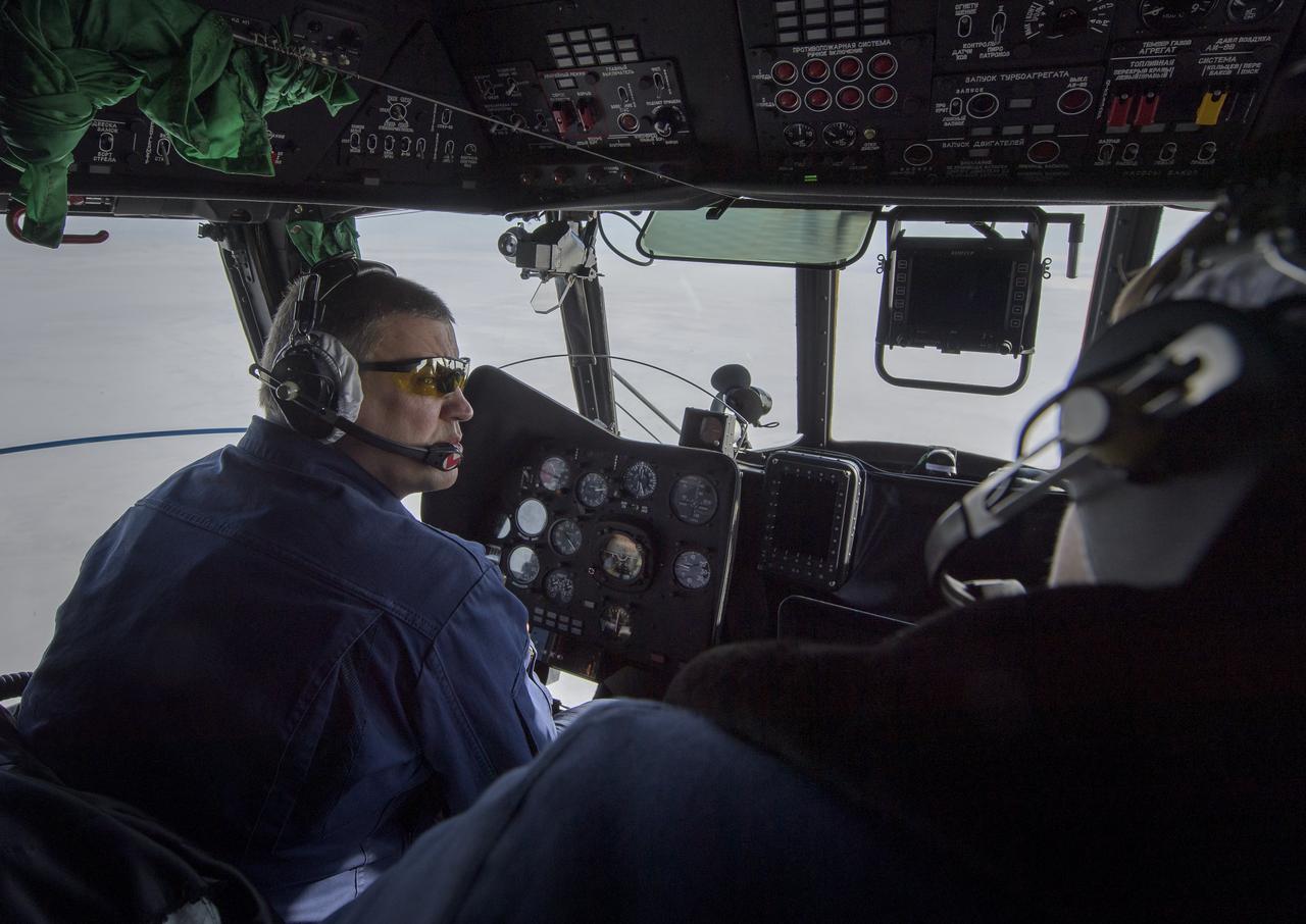 A Russian MI-8 helicopter pilot flies to the predicted landing zone of the Expedition 61 crew’s Soyuz MS-13 spacecraft near the town of Zhezkazgan, Kazakhstan Thursday, Feb. 6, 2020. Christina Koch returned to Earth after logging 328 days in space --- the longest spaceflight in history by a woman --- as a member of Expeditions 59-60-61 on the International Space Station. Roscosmos cosmonaut Alexander Skvortsov and ESA astronaut Luca Parmitano returned after 201 days in space where they served as Expedition 60-61 crew members onboard the station. Photo Credit: (NASA/Bill Ingalls)
