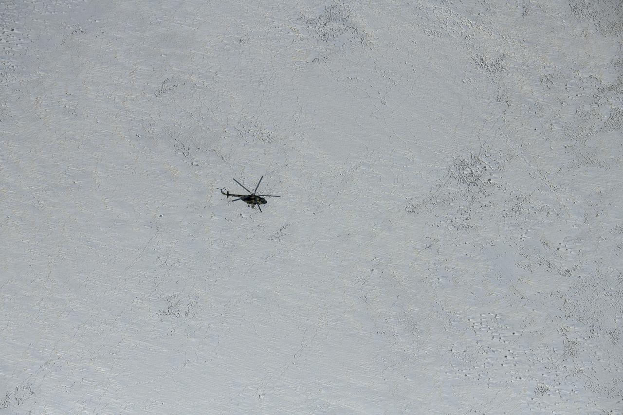 Russian MI-8 helicopters fly around the predicted landing zone of the Expedition 61 crew’s Soyuz MS-13 spacecraft near the town of Zhezkazgan, Kazakhstan Thursday, Feb. 6, 2020. Christina Koch returned to Earth after logging 328 days in space --- the longest spaceflight in history by a woman --- as a member of Expeditions 59-60-61 on the International Space Station. Roscosmos cosmonaut Alexander Skvortsov and ESA astronaut Luca Parmitano returned after 201 days in space where they served as Expedition 60-61 crew members onboard the station. Photo Credit: (NASA/Bill Ingalls)