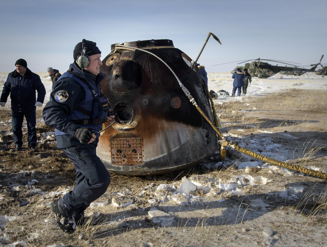 Russian Search and Rescue teams arrive at the Soyuz MS-13 spacecraft shortly after it landed in a remote area near the town of Zhezkazgan, Kazakhstan with Expedition 61 crew members Christina Koch of NASA, Alexander Skvortsov of the Russian space agency Roscosmos, and Luca Parmitano of ESA (European Space Agency) Thursday, Feb. 6, 2020. Koch returned to Earth after logging 328 days in space --- the longest spaceflight in history by a woman --- as a member of Expeditions 59-60-61 on the International Space Station. Skvortsov and Parmitano returned after 201 days in space where they served as Expedition 60-61 crew members onboard the station. Photo Credit: (NASA/Bill Ingalls)