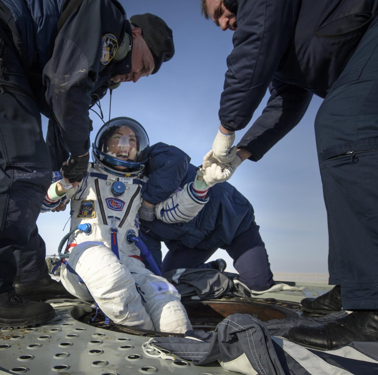 NASA astronaut Christina Koch is helped out of the Soyuz MS-13 spacecraft just minutes after she, Roscosmos cosmonaut Alexander Skvortsov, and ESA astronaut Luca Parmitano, landed in a remote area near the town of Zhezkazgan, Kazakhstan on Thursday, Feb. 6, 2020. Koch returned to Earth after logging 328 days in space --- the longest spaceflight in history by a woman --- as a member of Expeditions 59-60-61 on the International Space Station. Skvortsov and Parmitano returned after 201 days in space where they served as Expedition 60-61 crew members onboard the station. Photo Credit: (NASA/Bill Ingalls)