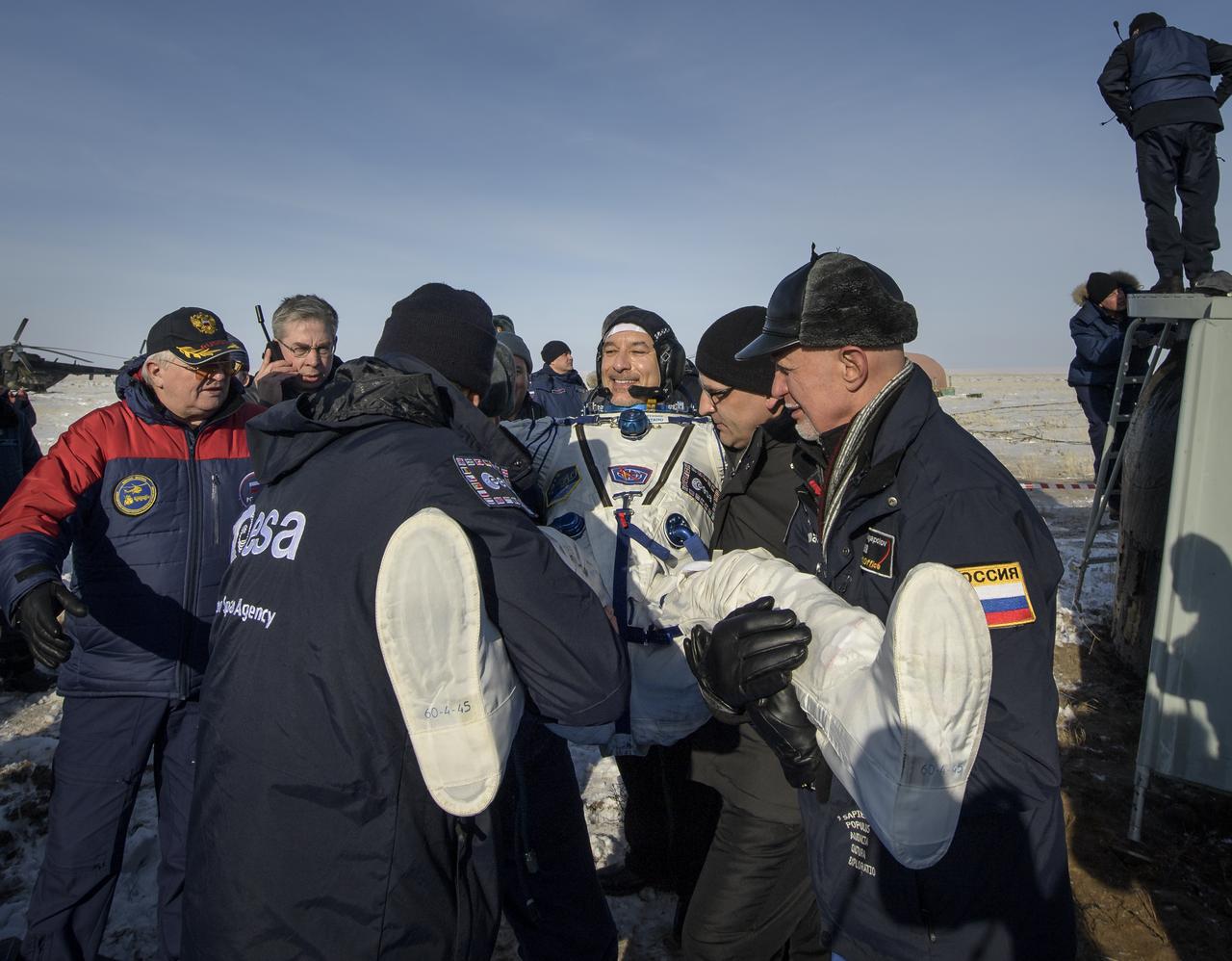 ESA astronaut Luca Parmitano is helped out of the Soyuz MS-13 spacecraft just minutes after he, NASA astronaut Christina Koch, and Roscosmos cosmonaut Alexander Skvortsov landed in a remote area near the town of Zhezkazgan, Kazakhstan on Thursday, Feb. 6, 2020. Koch returned to Earth after logging 328 days in space --- the longest spaceflight in history by a woman --- as a member of Expeditions 59-60-61 on the International Space Station. Skvortsov and Parmitano returned after 201 days in space where they served as Expedition 60-61 crew members onboard the station. Photo Credit: (NASA/Bill Ingalls)
