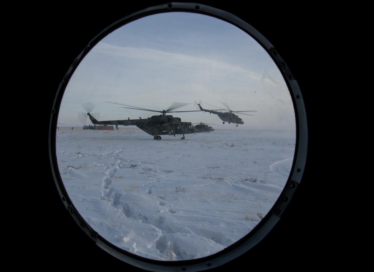 Helicopters depart the Soyuz MS-13 spacecraft landing site with NASA astronaut Christina Koch, ESA astronaut Luca Parmitano, and Roscosmos cosmonaut Alexander Skvortsovis in a remote area near the town of Zhezkazgan, Kazakhstan Thursday, Feb. 6, 2020. Koch returned to Earth after logging 328 days in space --- the longest spaceflight in history by a woman --- as a member of Expeditions 59-60-61 on the International Space Station. Skvortsov and Parmitano returned after 201 days in space where they served as Expedition 60-61 crew members onboard the station. Photo Credit: (NASA/Bill Ingalls)