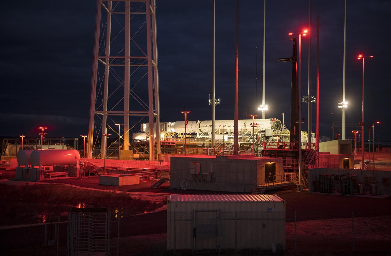 A Northrop Grumman Antares rocket carrying a Cygnus resupply spacecraft is horizontal for the final cargo load on Pad-0A, Friday, Feb. 7, 2020 at NASA's Wallops Flight Facility in Virginia. Northrop Grumman’s 13th contracted cargo resupply mission with NASA to the International Space Station will deliver more than 7,500 pounds of science and research, crew supplies and vehicle hardware to the orbital laboratory and its crew. Photo Credit: (NASA/Aubrey Gemignani)