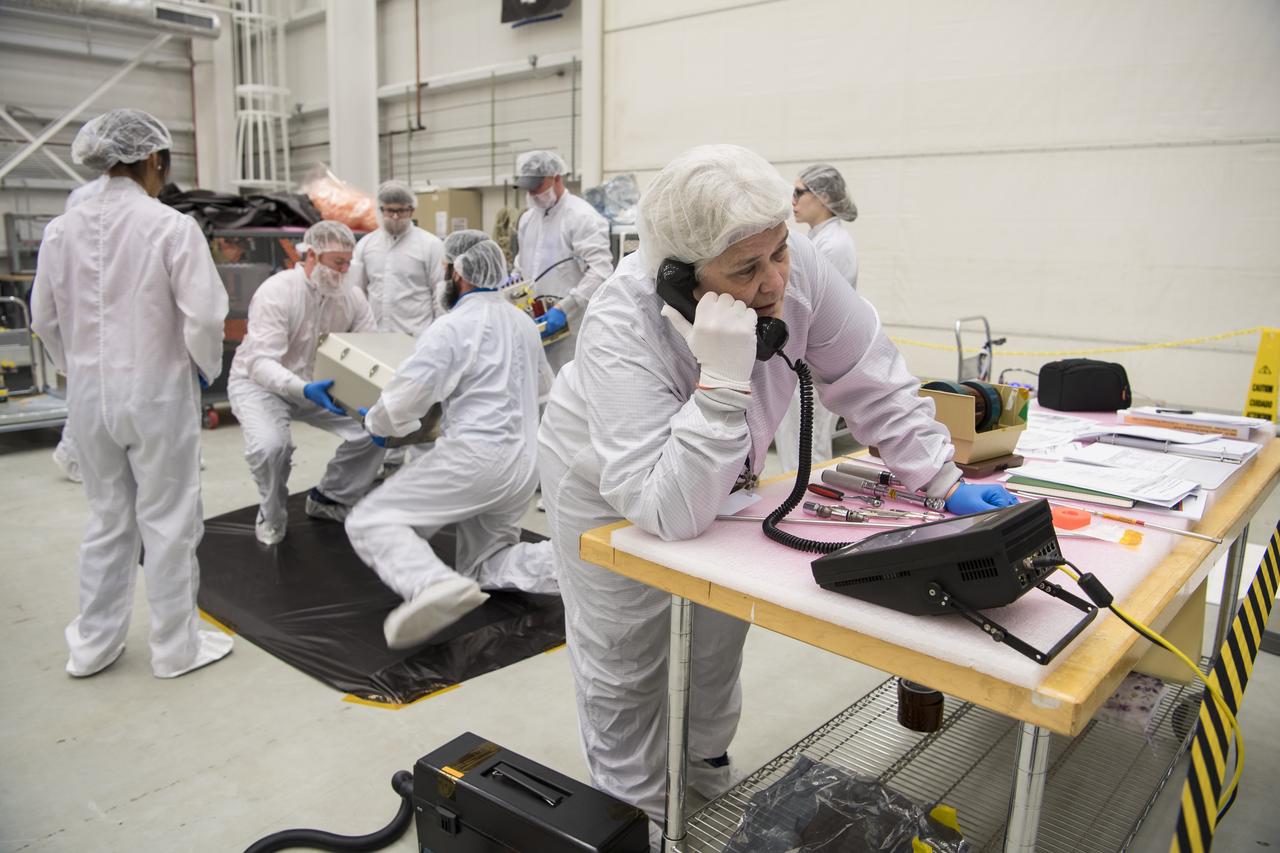 Mission engineers receive and prepare science and research and food items for the final cargo load into the Cygnus resupply spacecraft onboard the Northrop Grumman Antares rocket, Saturday, Feb. 8, 2020  at the Horizontal Integration Facility (HIF) of NASA's Wallops Flight Facility in Virginia. Northrop Grumman’s 13th contracted cargo resupply mission with NASA to the International Space Station will deliver more than 7,500 pounds of science and research, crew supplies and vehicle hardware to the orbital laboratory and its crew. Photo Credit: (NASA/Aubrey Gemignani)