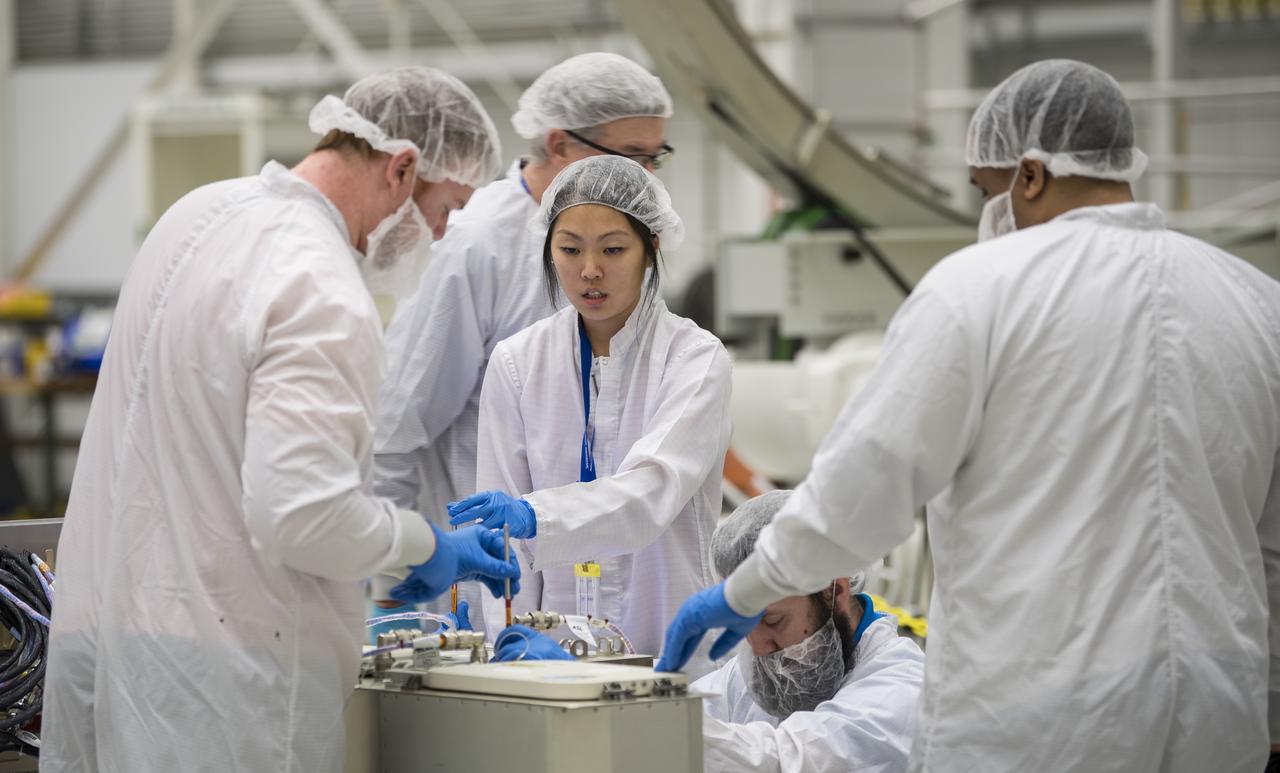 Mission engineers receive and prepare science and research and food items for the final cargo load into the Cygnus resupply spacecraft onboard the Northrop Grumman Antares rocket, Saturday, Feb. 8, 2020  at the Horizontal Integration Facility (HIF) of NASA's Wallops Flight Facility in Virginia. Northrop Grumman’s 13th contracted cargo resupply mission with NASA to the International Space Station will deliver more than 7,500 pounds of science and research, crew supplies and vehicle hardware to the orbital laboratory and its crew. Photo Credit: (NASA/Aubrey Gemignani)