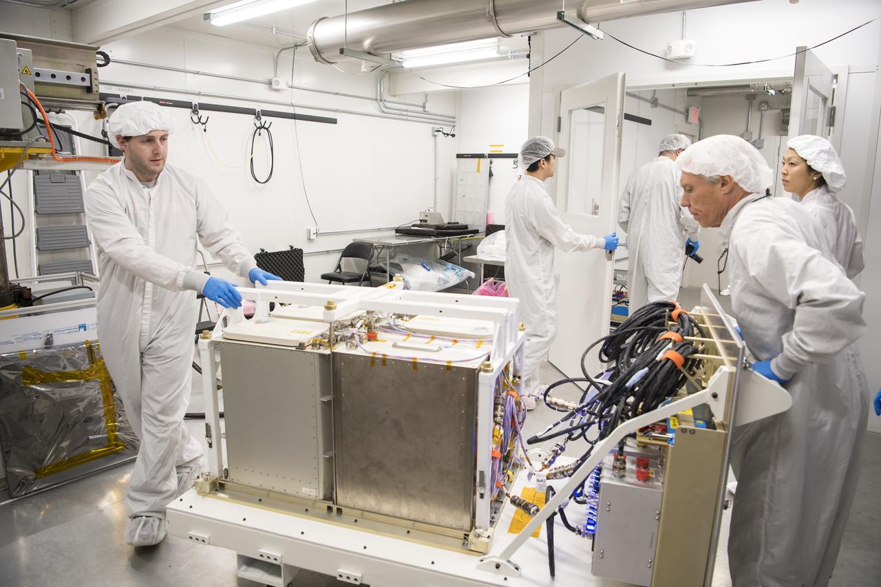 Mission engineers bring in the final cargo to load it into the Cygnus resupply spacecraft onboard the Northrop Grumman Antares rocket, Saturday, Feb. 8, 2020  at launch Pad-0A of NASA's Wallops Flight Facility in Virginia. Northrop Grumman’s 13th contracted cargo resupply mission with NASA to the International Space Station will deliver more than 7,500 pounds of science and research, crew supplies and vehicle hardware to the orbital laboratory and its crew. Photo Credit: (NASA/Aubrey Gemignani)