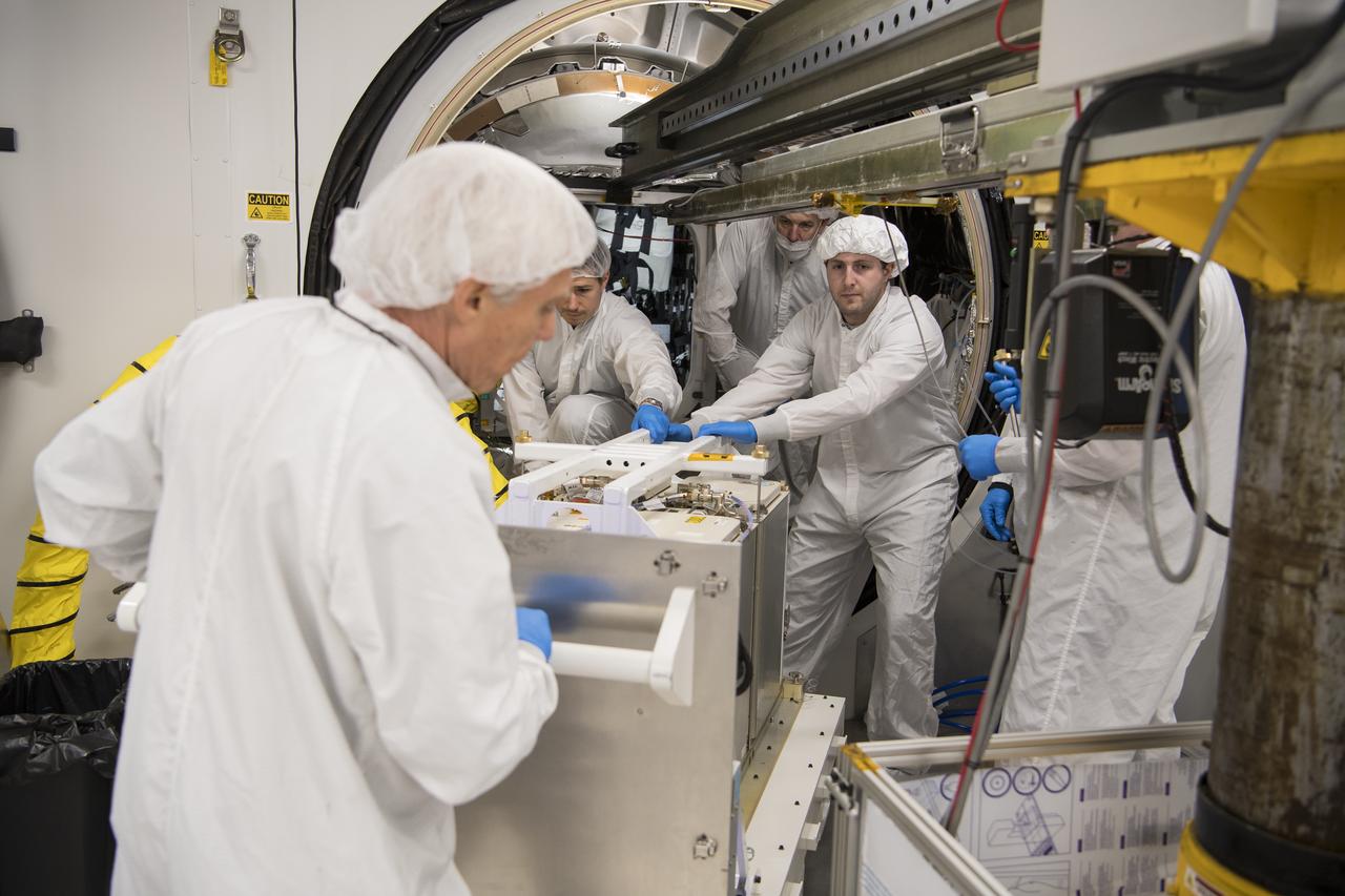Mission engineers bring in the final cargo to load it into the Cygnus resupply spacecraft onboard the Northrop Grumman Antares rocket, Saturday, Feb. 8, 2020  at launch Pad-0A of NASA's Wallops Flight Facility in Virginia. Northrop Grumman’s 13th contracted cargo resupply mission with NASA to the International Space Station will deliver more than 7,500 pounds of science and research, crew supplies and vehicle hardware to the orbital laboratory and its crew. Photo Credit: (NASA/Aubrey Gemignani)