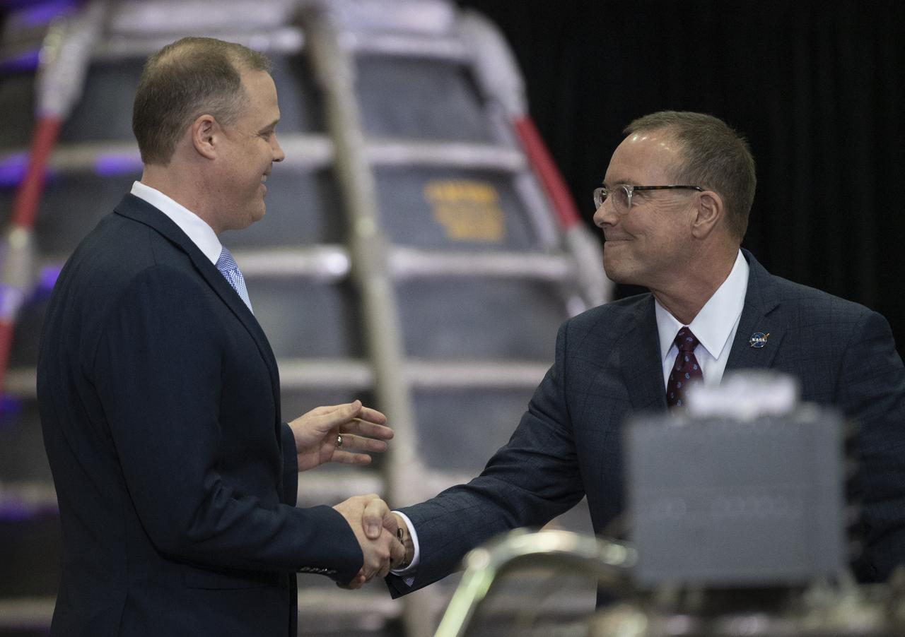 Richard Gilbrech, Director of NASA's Stennis Space Center, right, shakes hands with NASA Administrator Jim Bridenstine after introducing him at the State of NASA address, Monday, Feb. 10, 2020, at Aerojet Rocketdyne’s facility at NASA’s Stennis Space Center near Bay St. Louis, Mississippi.  Photo Credit: (NASA/Joel Kowsky)