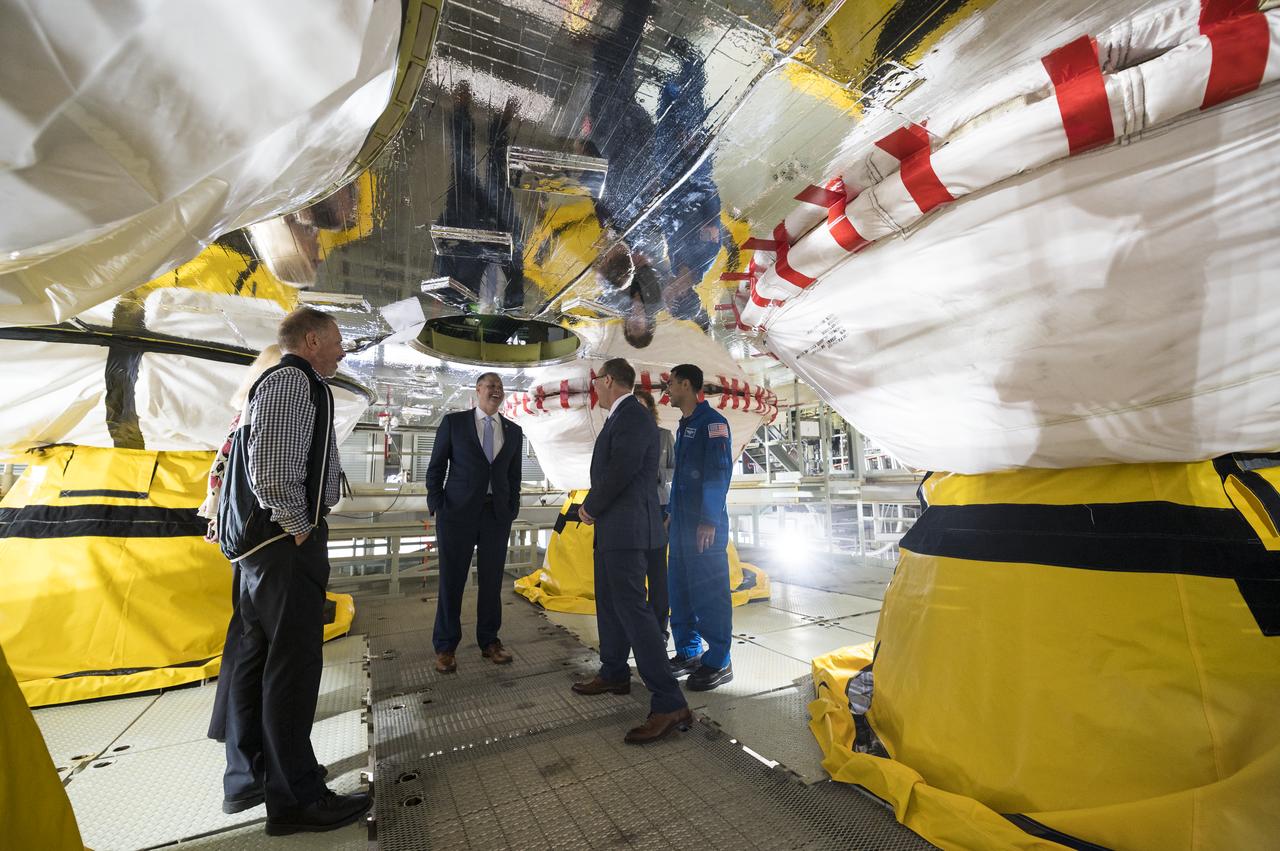NASA Administrator Jim Bridenstine, center, is seen on a work platform between the four RS-25 engines of the first core stage of the agency’s Space Launch System (SLS) rocket along with Lisa Bates, SLS Deputy Stages Manager at NASA, Mark Nappi, Boeing Green Run Test Manager, Richard Gilbrech, Director of NASA's Stennis Space Center, Julie Bassler, SLS Stages Manager at NASA, and NASA astronaut Raja Chari, during a tour of the B-2 Test Stand, Monday, Feb. 10, 2020, at NASA’s Stennis Space Center near Bay St. Louis, Mississippi. Over the coming months, the first core stage of NASA’s SLS rocket will be undergoing a series of integrated Green Run tests prior to its maiden flight. Photo Credit: (NASA/Joel Kowsky)