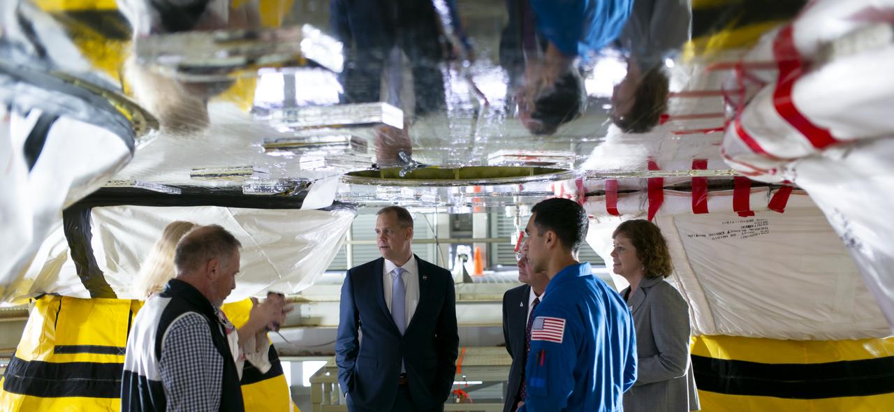 NASA Administrator Jim Bridenstine, center, is seen on a work platform between the four RS-25 engines of the first core stage of the agency’s Space Launch System (SLS) rocket along with Lisa Bates, SLS Deputy Stages Manager at NASA, Mark Nappi, Boeing Green Run Test Manager, Richard Gilbrech, Director of NASA's Stennis Space Center, Julie Bassler, SLS Stages Manager at NASA, and NASA astronaut Raja Chari, during a tour of the B-2 Test Stand, Monday, Feb. 10, 2020, at NASA’s Stennis Space Center near Bay St. Louis, Mississippi. Over the coming months, the first core stage of NASA’s SLS rocket will be undergoing a series of integrated Green Run tests prior to its maiden flight. Photo Credit: (NASA/Joel Kowsky)